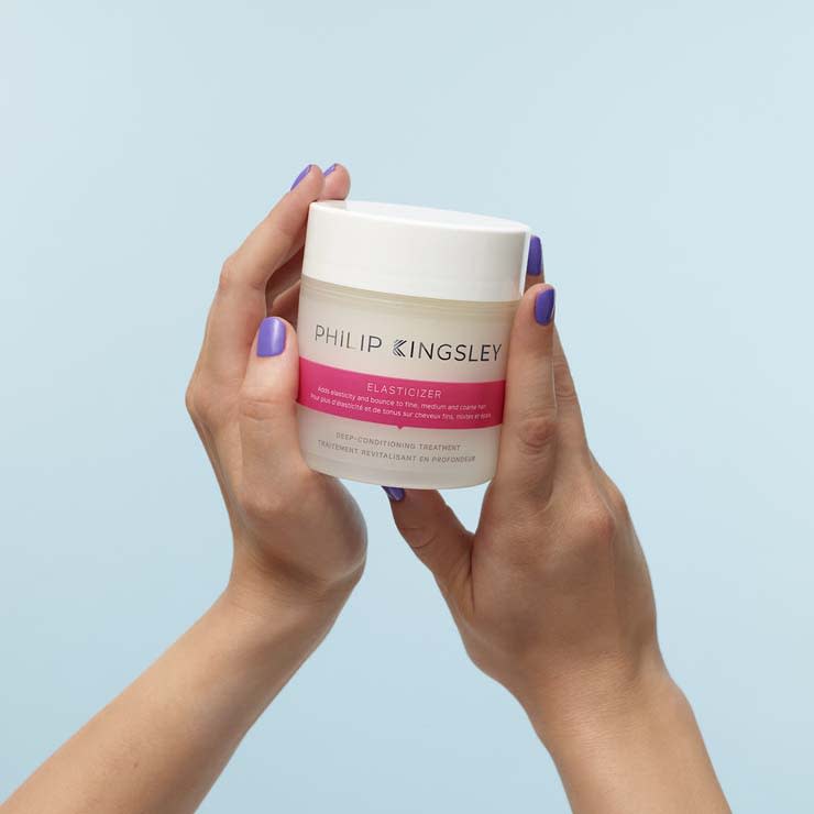 Woman holding Philip Kingsley Elasticizer