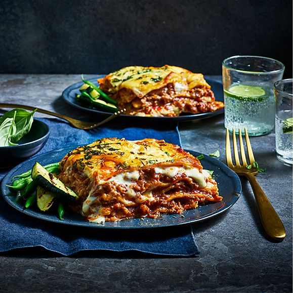 Two plates of Our Best Ever lasagne on a table