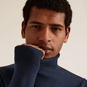 Man wearing roll-neck jumper