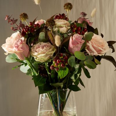 Vases filled with pink roses. Shop flowers