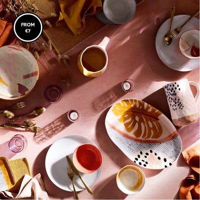 Handpainted patterned crockery on table