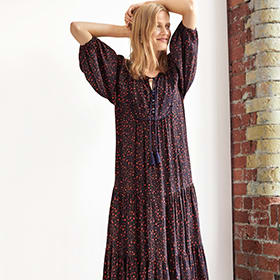 Woman wearing a navy floral midi dress