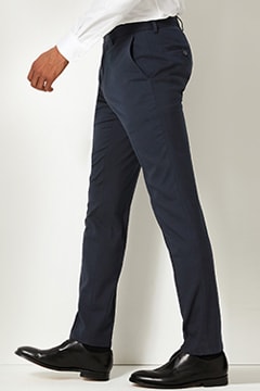 Man wearing navy blue skinny-fit trousers