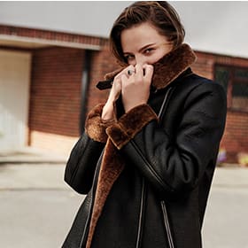 Woman wearing black aviator jacket