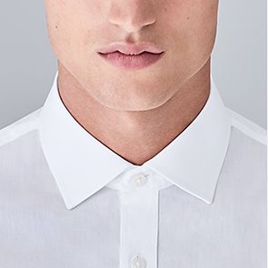 Man wearing semi cut-away collar shirt