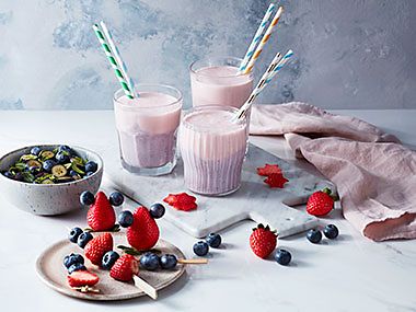 Berry smoothies and fresh strawberry and blueberry skewers